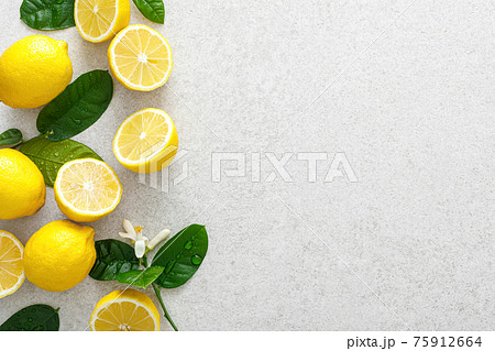 Lemons. Fresh juicy lemons with leaves on white background Lemons. Fresh juicy lemons with leaves on white background 75912664