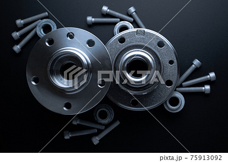 Spare parts. Auto motor mechanic spare or automotive piece on dark background. Set of new metal car part. Flat lay, top view, copy space. 75913092