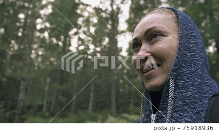 Traveler photographing scenic view in forest. One caucasian woman shooting close up look. Girl take photo video on dslr mirrorless camera. 75918936