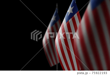 Small national flags of the Liberia on a black background Small national flags of the Liberia on a black background 75922193