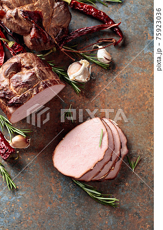 Smoked ham with rosemary, garlic, and red pepper. Smoked ham with rosemary, garlic, and red pepper. 75923036