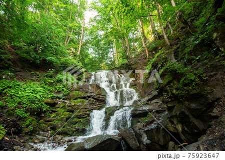 small waterfall of mountain river 75923647