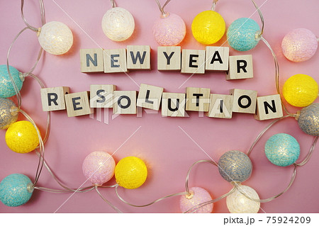 New Year Resolution alphabet letter on pink background 75924209