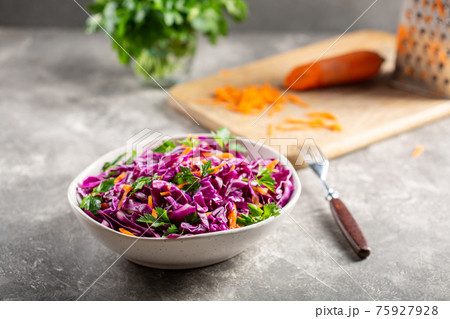 Red cabbage salad with carrots in a bowl. Red cabbage salad with carrots in a bowl. 75927928