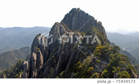 Huangshan Mountain in Anhui Province, China. View of Yuping Hotel and Celestial Capital Peak with Huangshan mountain path leading from Lotus Peak. Scenic view on Huangshan Mountain, China. 75930573