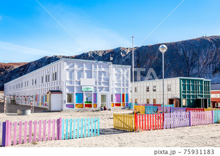 Modern greenlandic kindergarten with playground and colorful fen 75931183