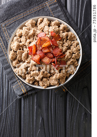 Traditional dish of Slovenia is Ajdovi Zganci close-up in a bowl. vertical top view 75931786