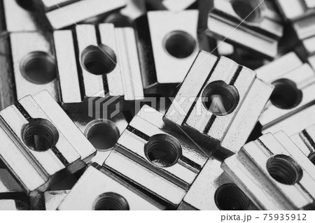 slide screw nuts heap, closeup view slide screw nuts heap, closeup view 75935912