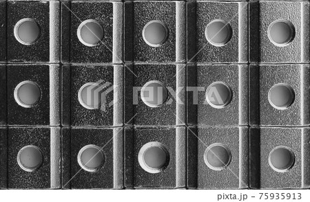 slide screw nuts in a row, abstract industrial background slide screw nuts in a row, abstract industrial background 75935913