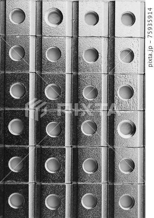 slide screw nuts in a row, abstract industrial background 75935914