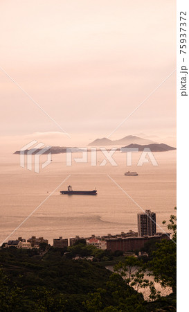 Hong Kong ocean sunset mountain heaven background nautical vessel cargo ship industry Hong Kong ocean sunset mountain heaven background nautical vessel cargo ship industry 75937372