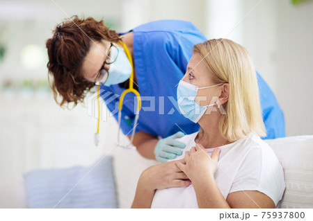 Doctor examining sick patient. Ill woman in clinic 75937800