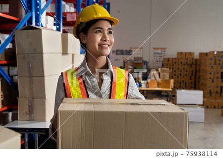 Female warehouse worker working at the storehouse 75938114