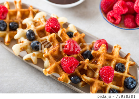 Traditional homemade belgian waffles with fresh berries and syru 75938281