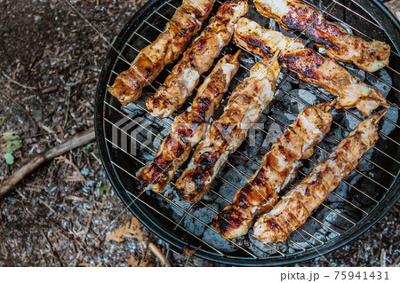 bbq meat on charcoal grill top view bbq meat on charcoal grill top view 75941431