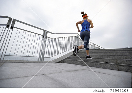 Healthy lifestyle fitness sports woman runner running on seaside trail Healthy lifestyle fitness sports woman runner running on seaside trail 75945103