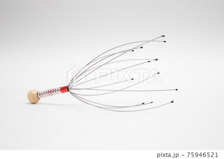 Head massager on a white background. Goosebumps generator 75946521