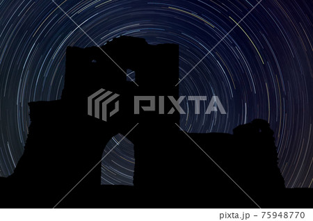 Castle at night with startrail in the background 75948770