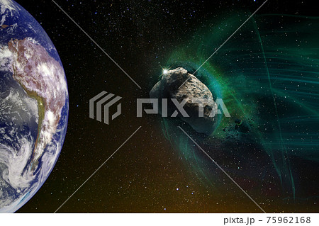 Giant meteorite in green light flies towards planet Earth, global space catastrophe concept. The elements of this image furnished by NASA. 75962168
