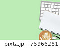 Green pastel office desk table with coffee, computer keyboard, notebook and pencil. Top view with copy space, flat lay. 75966281