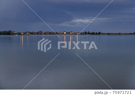 night over a calm lake in Colorado 75971721