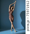 Fit, flexible dancer wearing a trendy, elegant dress 75971912