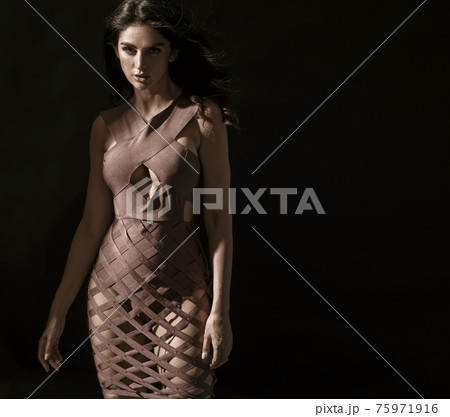 Portrait of a young, brunette, classy woman posing in shade Portrait of a young, brunette, classy woman posing in shade 75971916