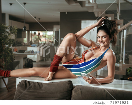 Portrait of a fit, stretching woman 75971921