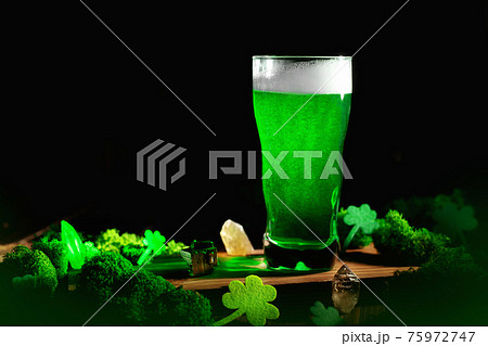 St. Patrick's Day Green Beer pint over wooden background 75972747