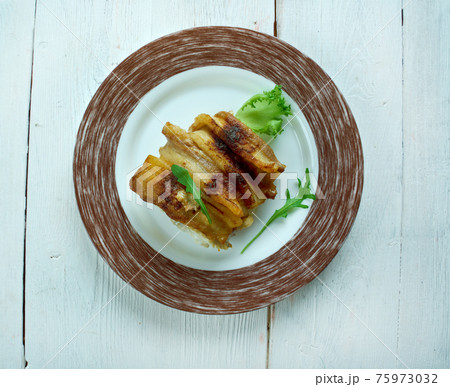 Baked cod wrapped in bacon 75973032