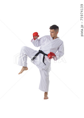 Man training taekwondo on white 75974139