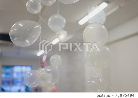 White And Transparent Balloons On Brick Wall Background. 75975494