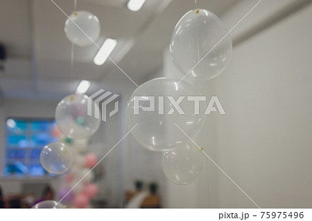 White And Transparent Balloons On Brick Wall Background. 75975496