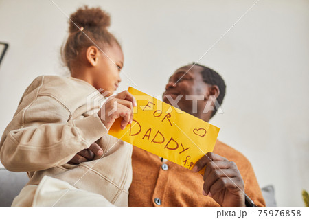 Little Girl Giving Letter to Dad 75976858