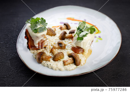 Delicious mushroom risotto and grilled turkey meat 75977286