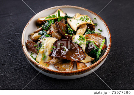 Vegan saute with mushrooms, aubergines and spinach Vegan saute with mushrooms, aubergines and spinach 75977290