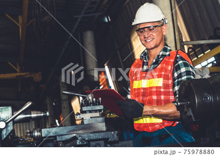 Smart factory worker or engineer do machine job in a manufacturing workshop Smart factory worker or engineer do machine job in a manufacturing workshop 75978880