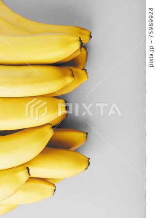 Fresh bunch of yellow bananas isolated on a Gray background Trendy colors of 2021 75989928
