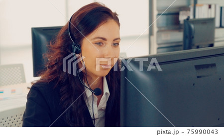 Business people wearing headset working in office 75990043
