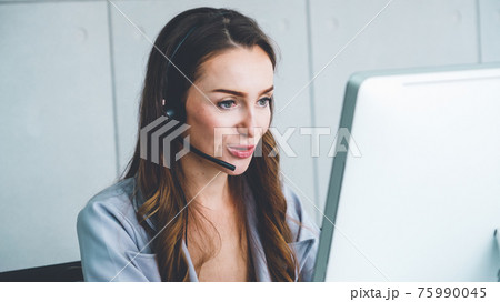 Business people wearing headset working in office 75990045