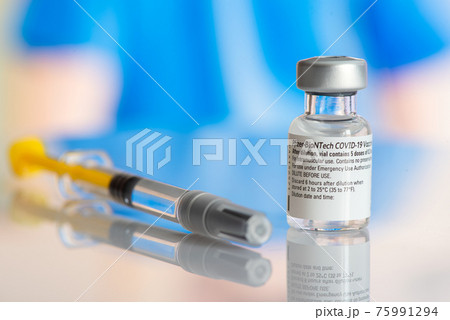 Galati, Romania - February 16, 2021: Pfizer Biontech vaccine and syringe to protect against coronavirus COVID-19 disease. Galati, Romania - February 16, 2021: Pfizer Biontech vaccine and syringe to protect against coronavirus COVID-19 disease. 75991294