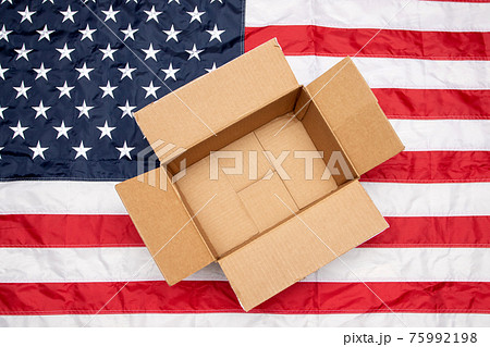 USA flag and shipping box. Delivery from the USA 75992198