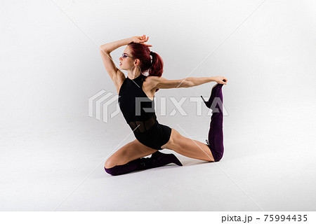 Sexy pole redhead dancer showing her body. Sexy pole redhead dancer showing her body. 75994435