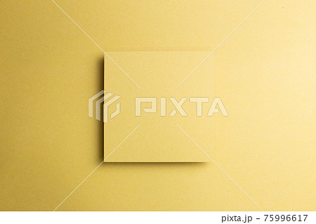 Blank memo pad on yellow gold background. top view, copy space 75996617