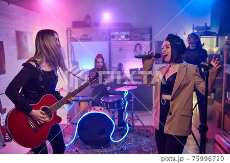 Music band performing in the club 75996720