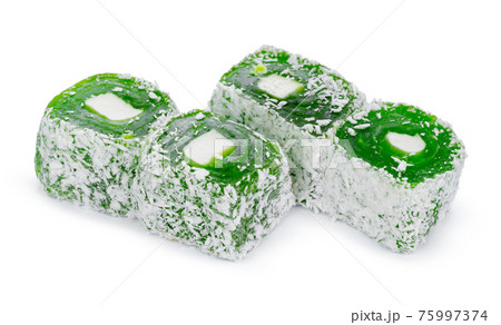 Close up of green Turkish delight sweets isolated on white 75997374