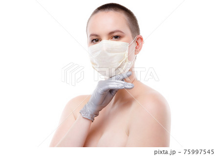 Beauty portrait of a short-haired woman in mask and gloves Beauty portrait of a short-haired woman in mask and gloves 75997545