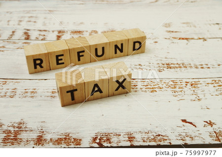 Tax Refund Word alphabet letters on wooden background 75997977