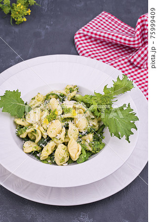orecchiette alla pugliese, homemade Italian pasta. Orecchiette with turnip tops. Traditional food of orecchiette alla pugliese, homemade Italian pasta. Orecchiette with turnip tops. Traditional food of 75999409