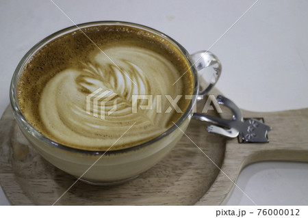 A cup of hot coffee latte with art A cup of hot coffee latte with art 76000012